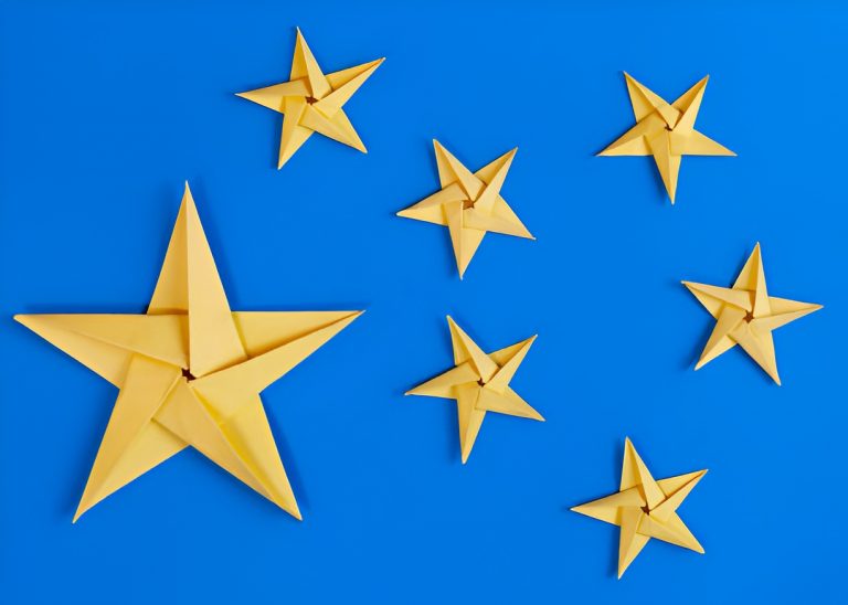 gold paper stars on a blue surface